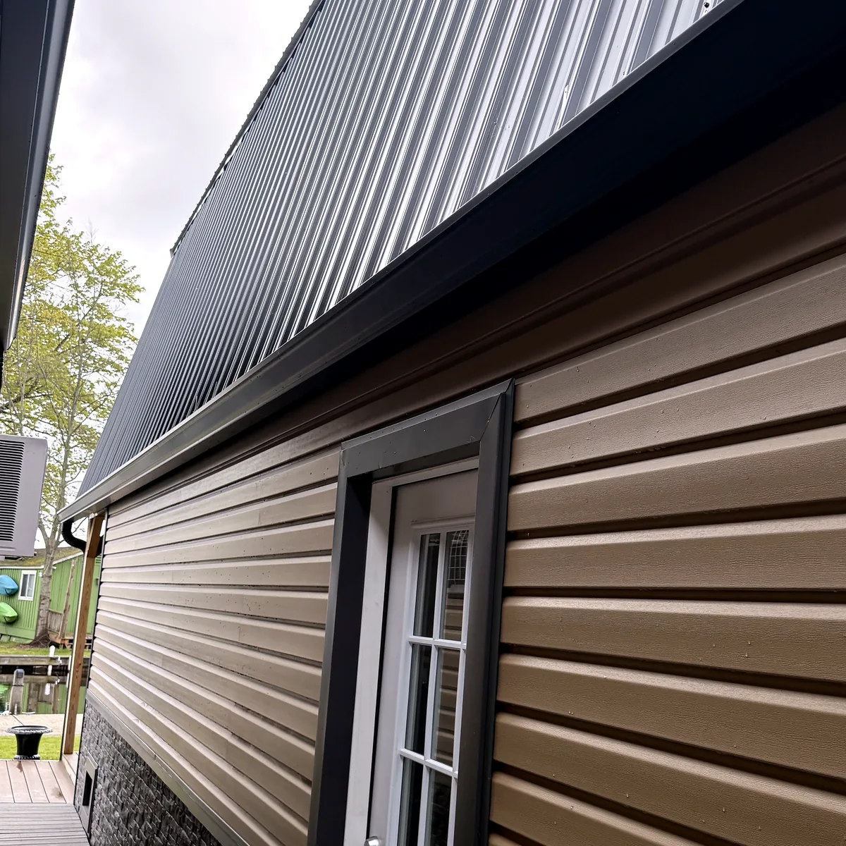 Side elevation showing siding, window, and exterior trim details.